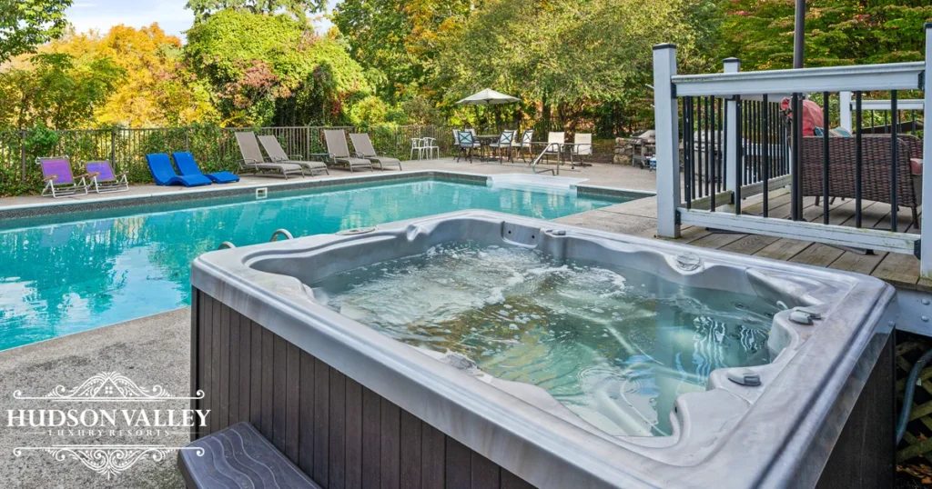 Heated pool and stone patio at Knoll Shoal Farmhouse luxury estate Cornwall NY