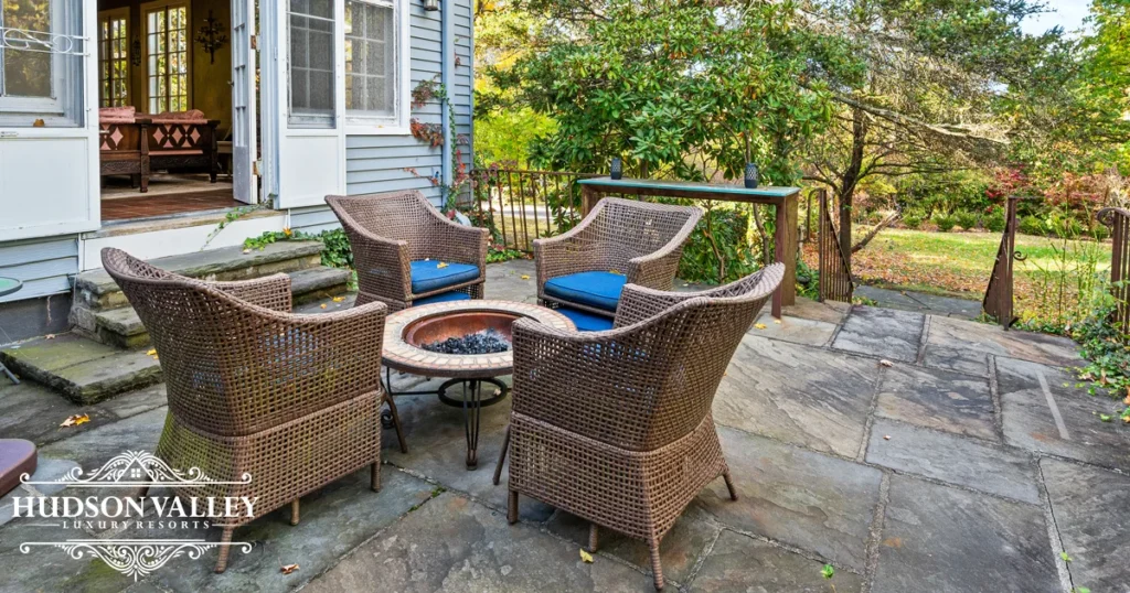 Outdoor fire pit and patio at luxury estate near West Point Cornwall NY evening