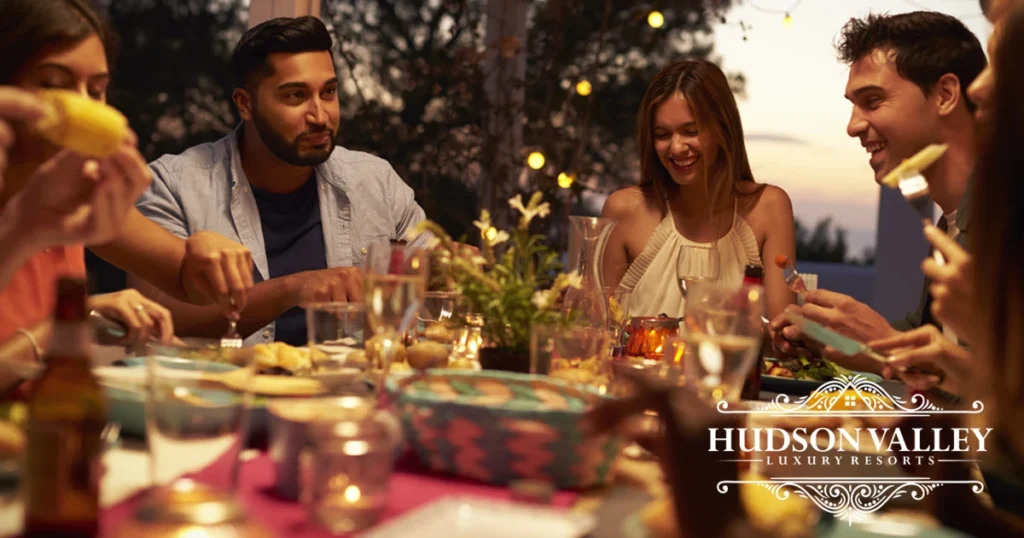 Large group celebrating at luxury private estate in Hudson Valley sunset